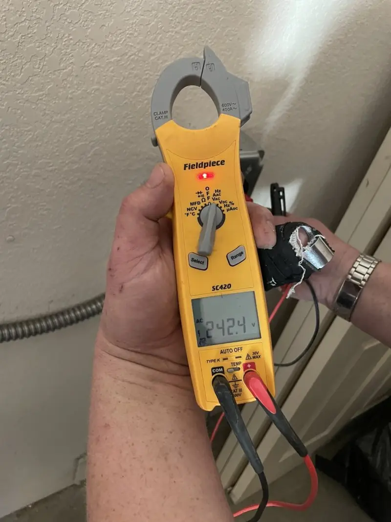 Voltage testing with clamp meter during Recessed Lighting Installation in Crouch Mesa